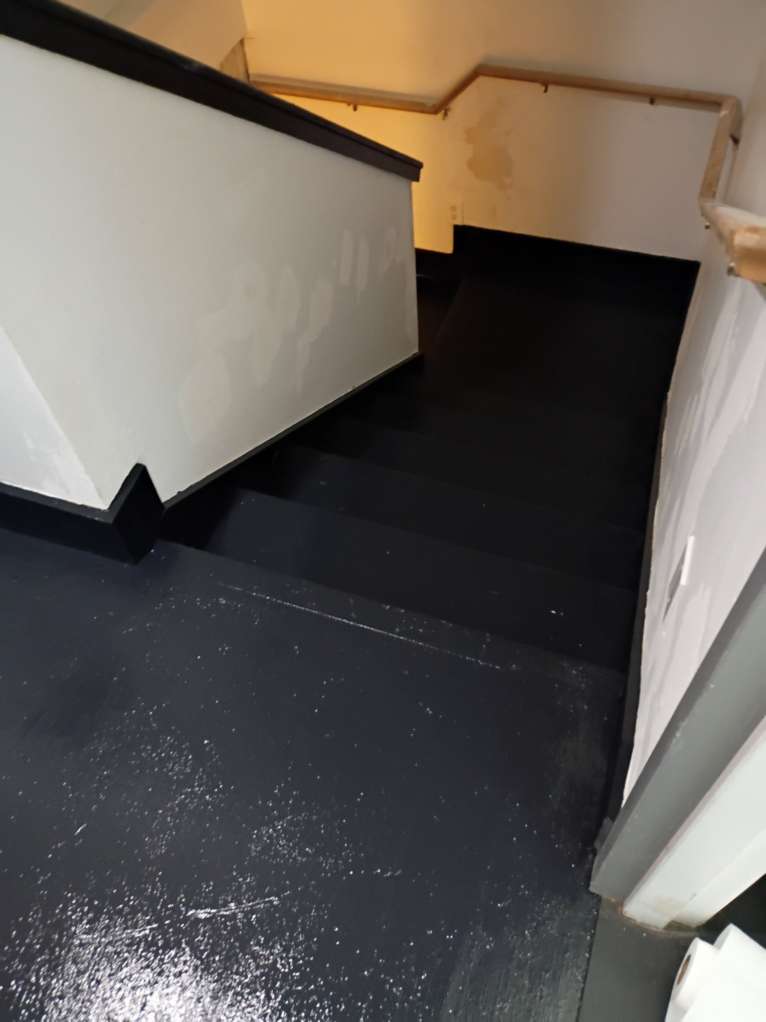 Basement stairs refinished in glossy black