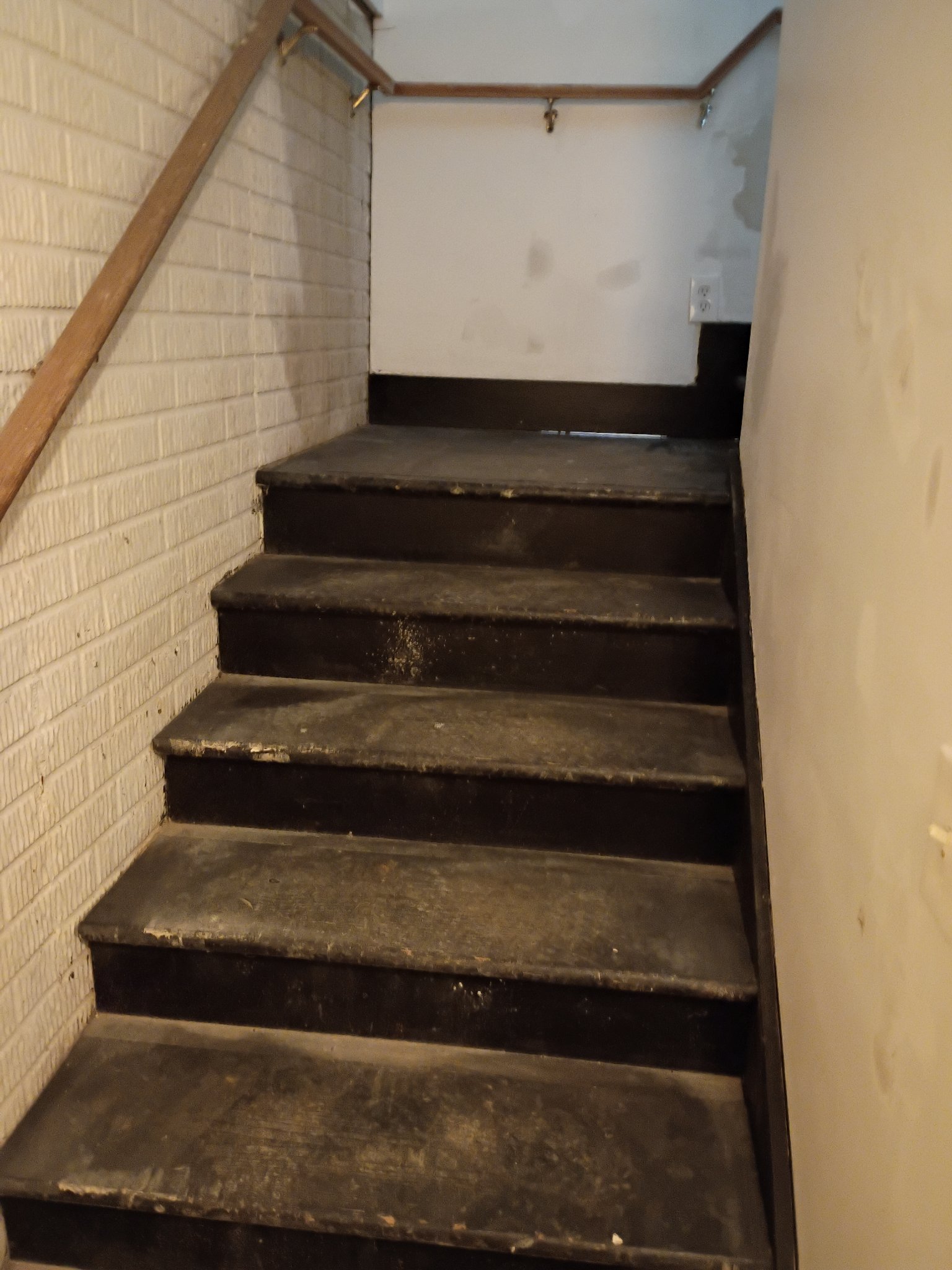 Worn basement stairs before refinishing