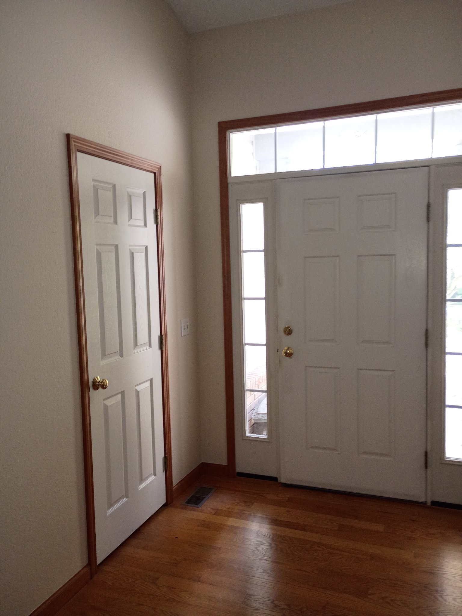 Foyer repainted in Natural Linen at the front door