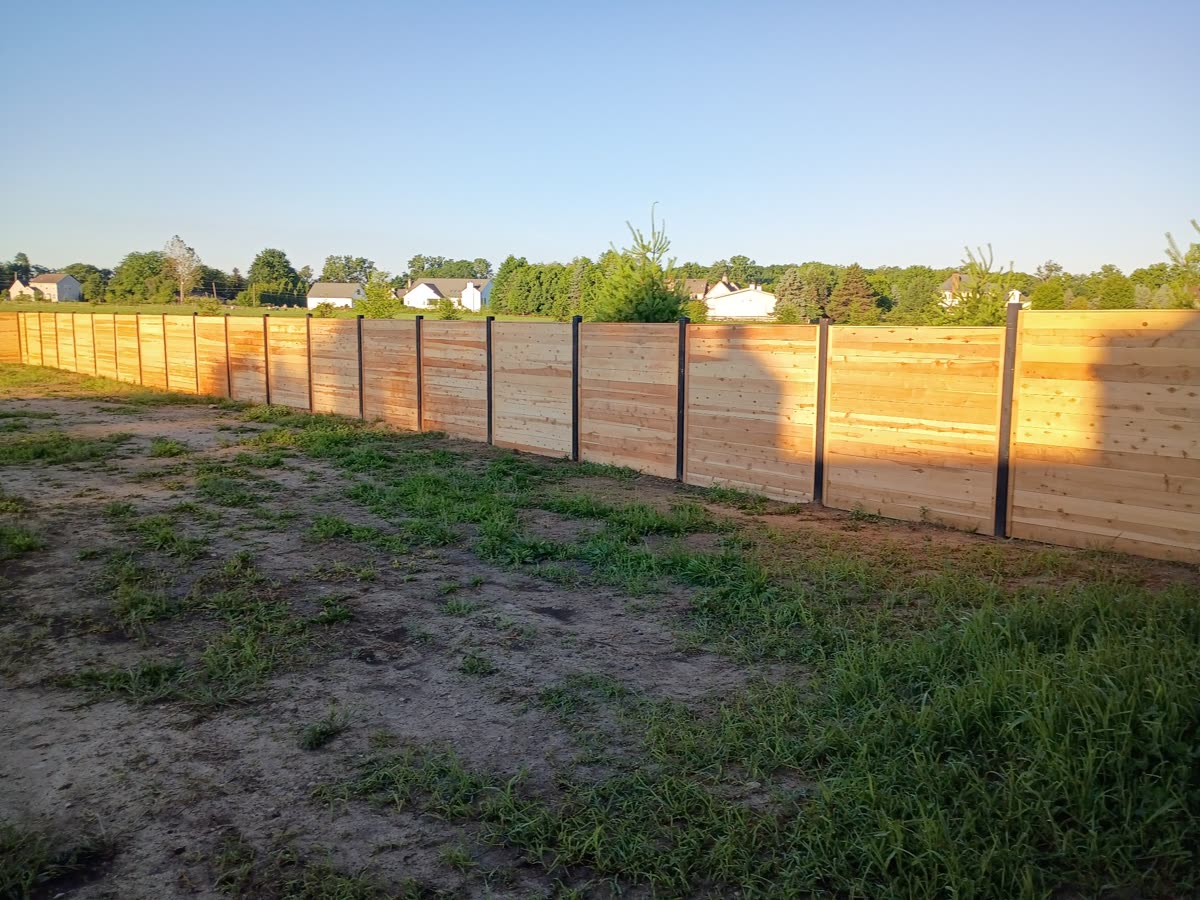 Raw cedar fence before staining