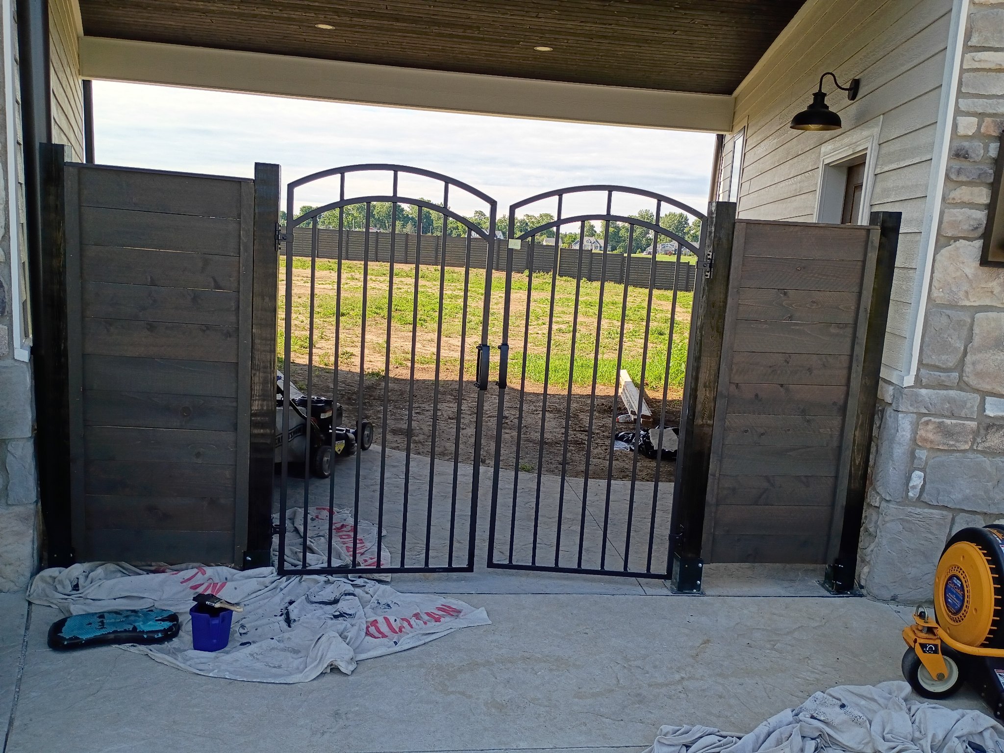 Finished iron gate with stained cedar panels