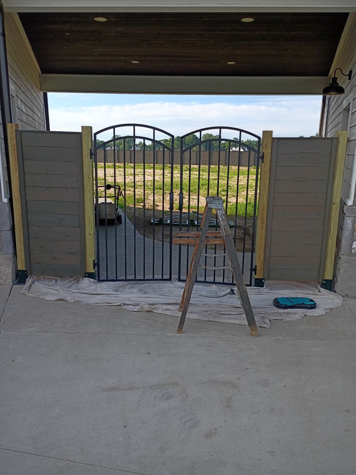 Iron gate with cedar panels
